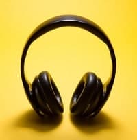 black headphones with yellow background