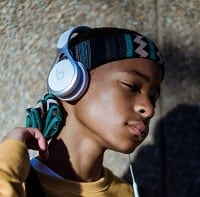 boy listening to music on beats headphones
