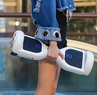 Girl holding White hoverboard in hand