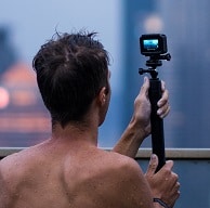 man vlogging in pool