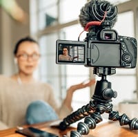 YouTuber recording a video on camera
