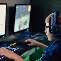 kid playing games on a computer