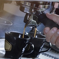 Making two cups of espresso coffee on a machine