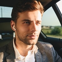 man wearing truly wireless earbuds