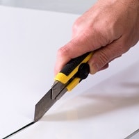 Cutting paper with utility knife