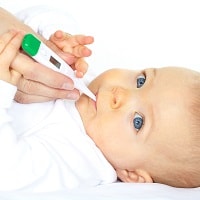 baby with clinical thermometer